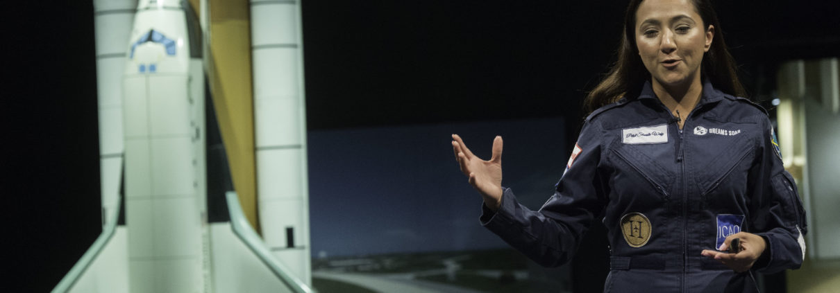Shaesta Waiz speaks to a middle school girls at the Smithsonian National Air & Space Museum.