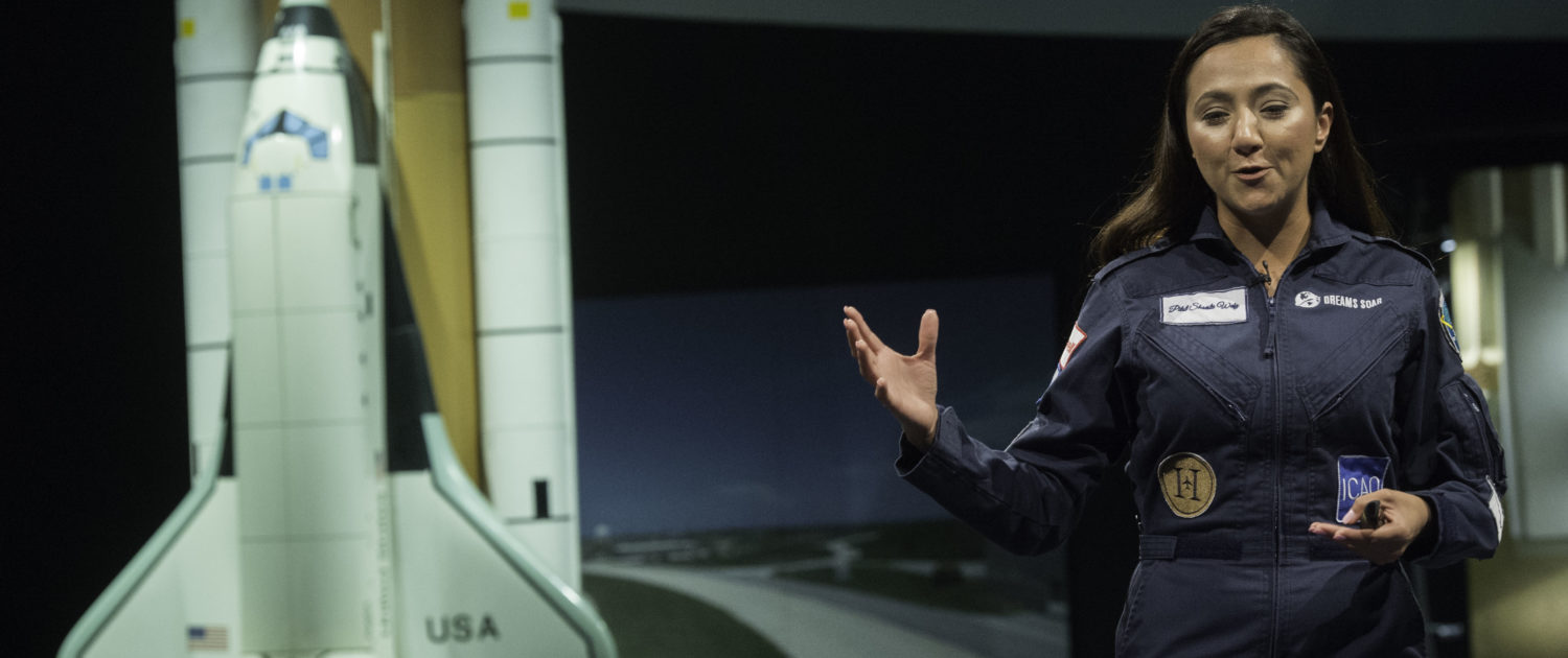 Shaesta Waiz speaks to a middle school girls at the Smithsonian National Air & Space Museum.