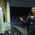 Shaesta Waiz speaks to a middle school girls at the Smithsonian National Air & Space Museum.