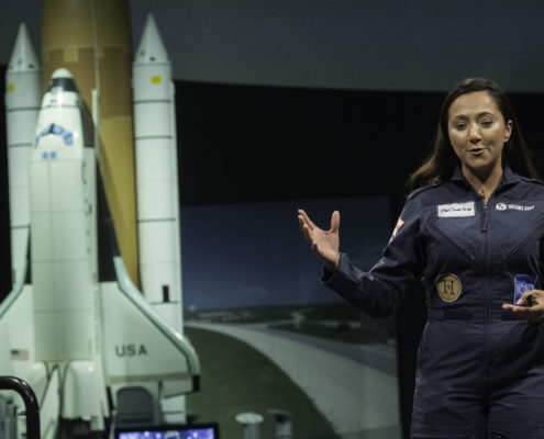 Shaesta Waiz speaks to a middle school girls at the Smithsonian National Air & Space Museum.