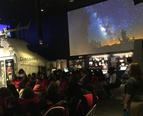 Shaesta Waiz speaks to a middle school girls at the Smithsonian.