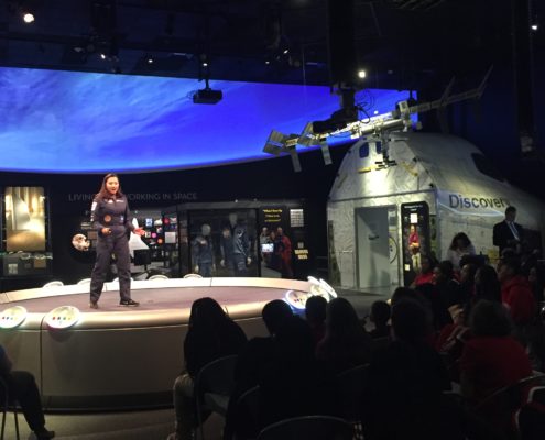 Shaesta Waiz speaks to a middle school girls at the Smithsonian.