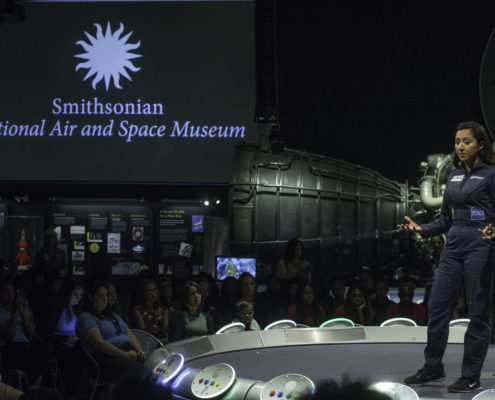 Shaesta Waiz speaks to a middle school girls at the Smithsonian National Air & Space Museum.